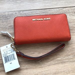 Michael Kors large multi function phone case.